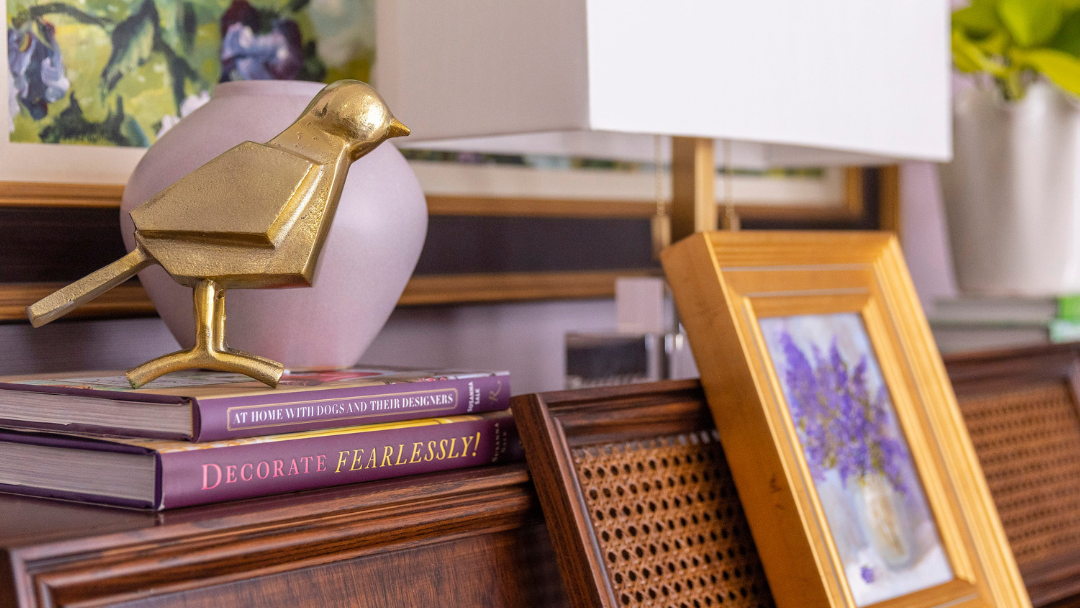 Gold and lavender home decor on antique piano.